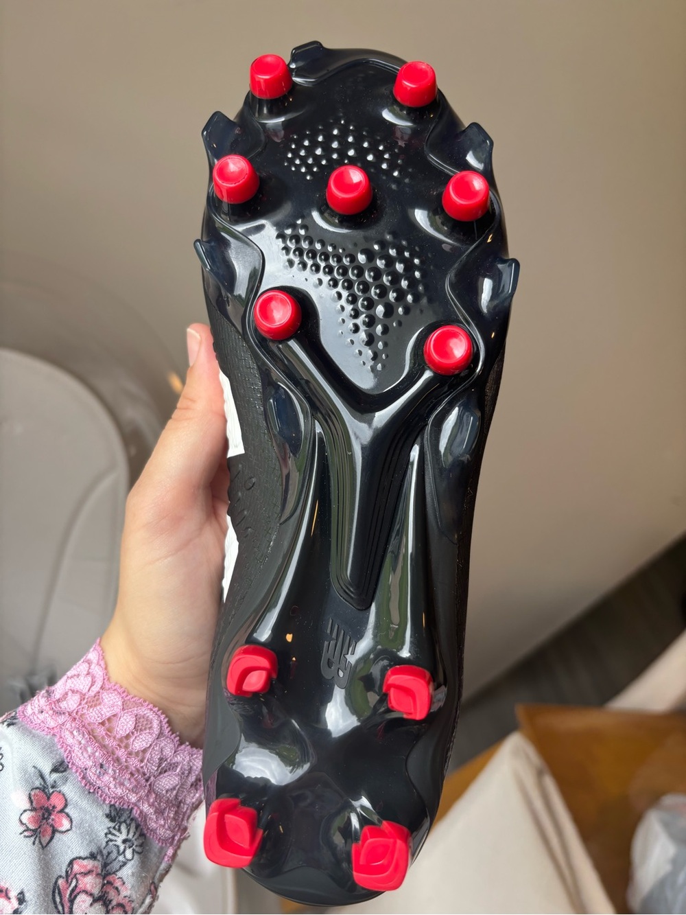 New Balance Black Soccer Cleat with White Logo and Red Stud Accents - Picture 3 of 5